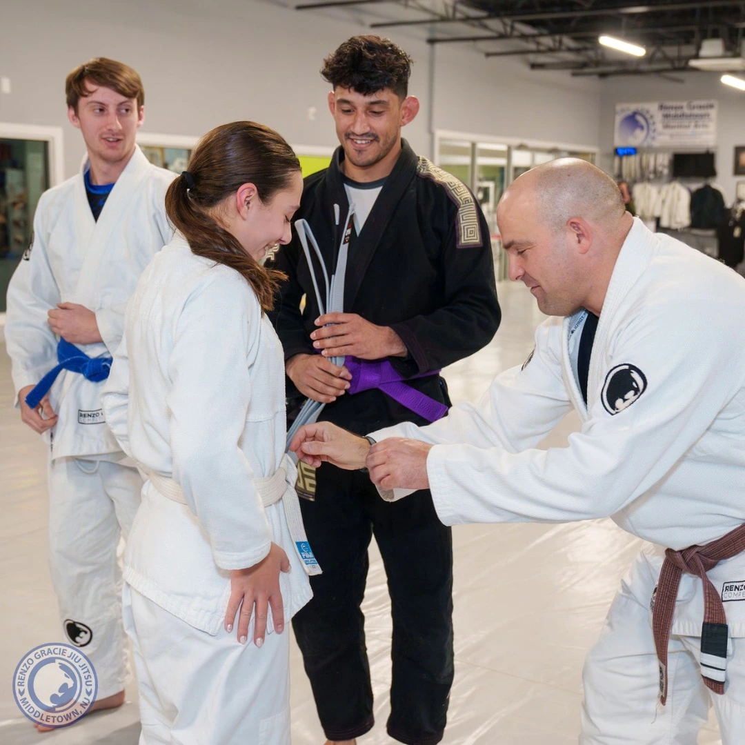Renzo Gracie Middletown teen receiving belt promotion from instructor