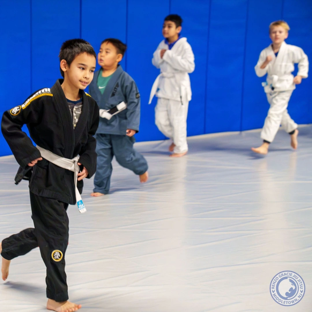 Renzo Gracie Middletown kids running warm-ups across the mats